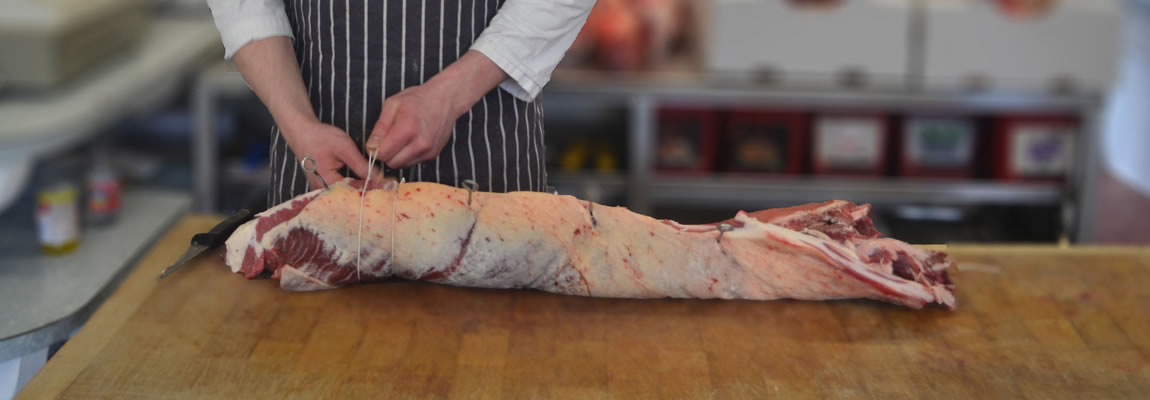 butcher prepares loin